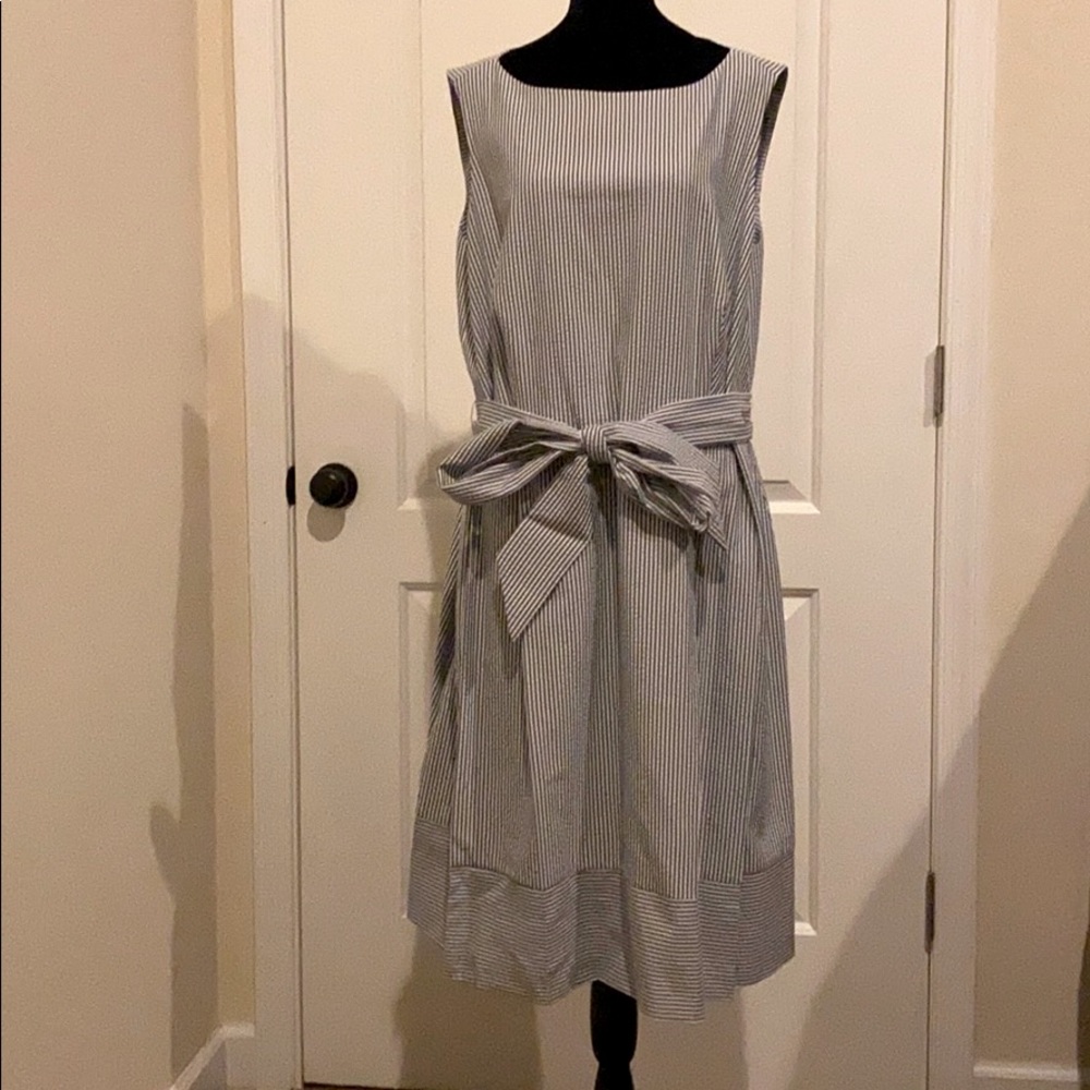 Woman’s sleeveless summer dress with belt
